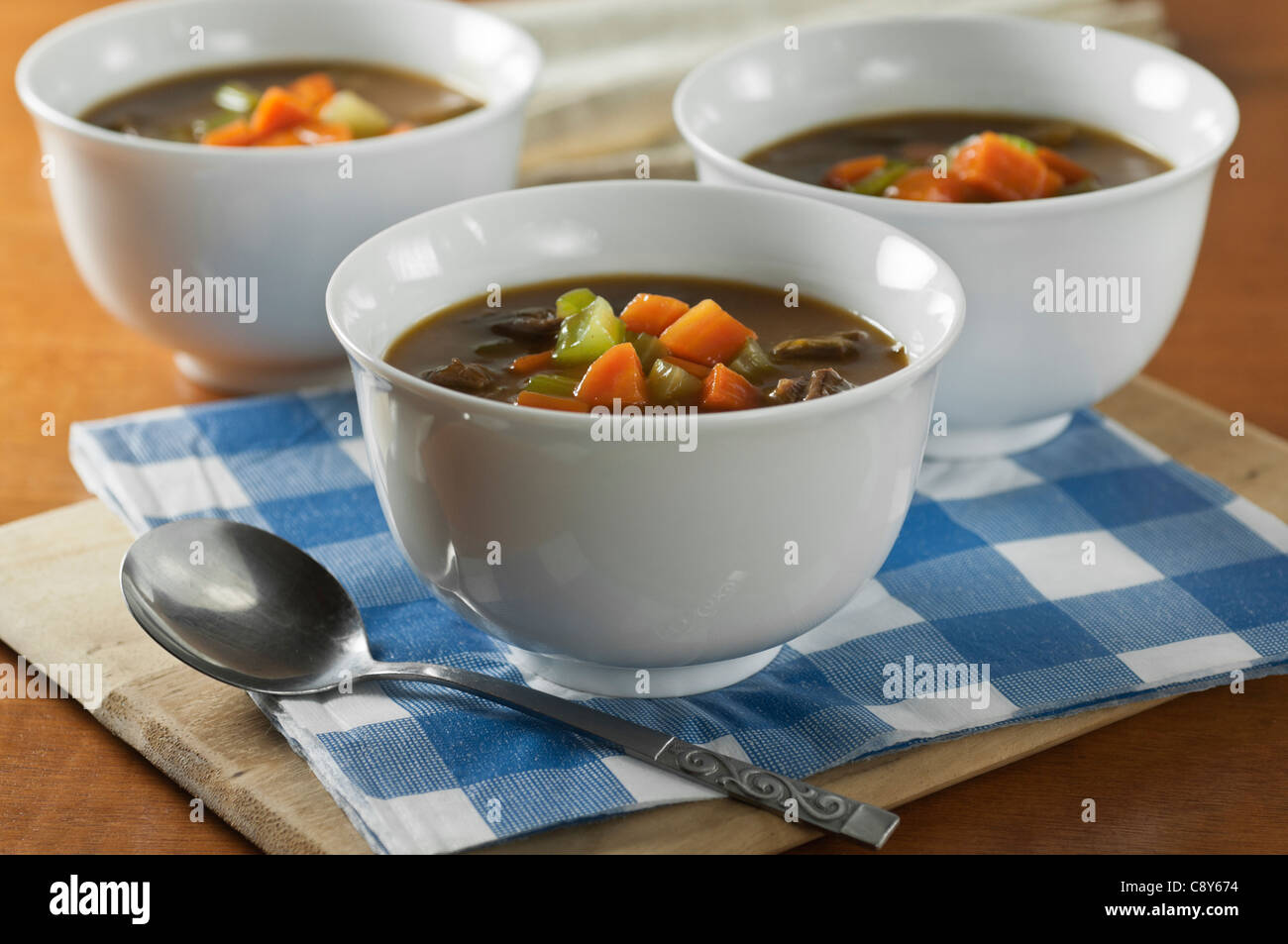 Oxtail soup in white bowls Stock Photo