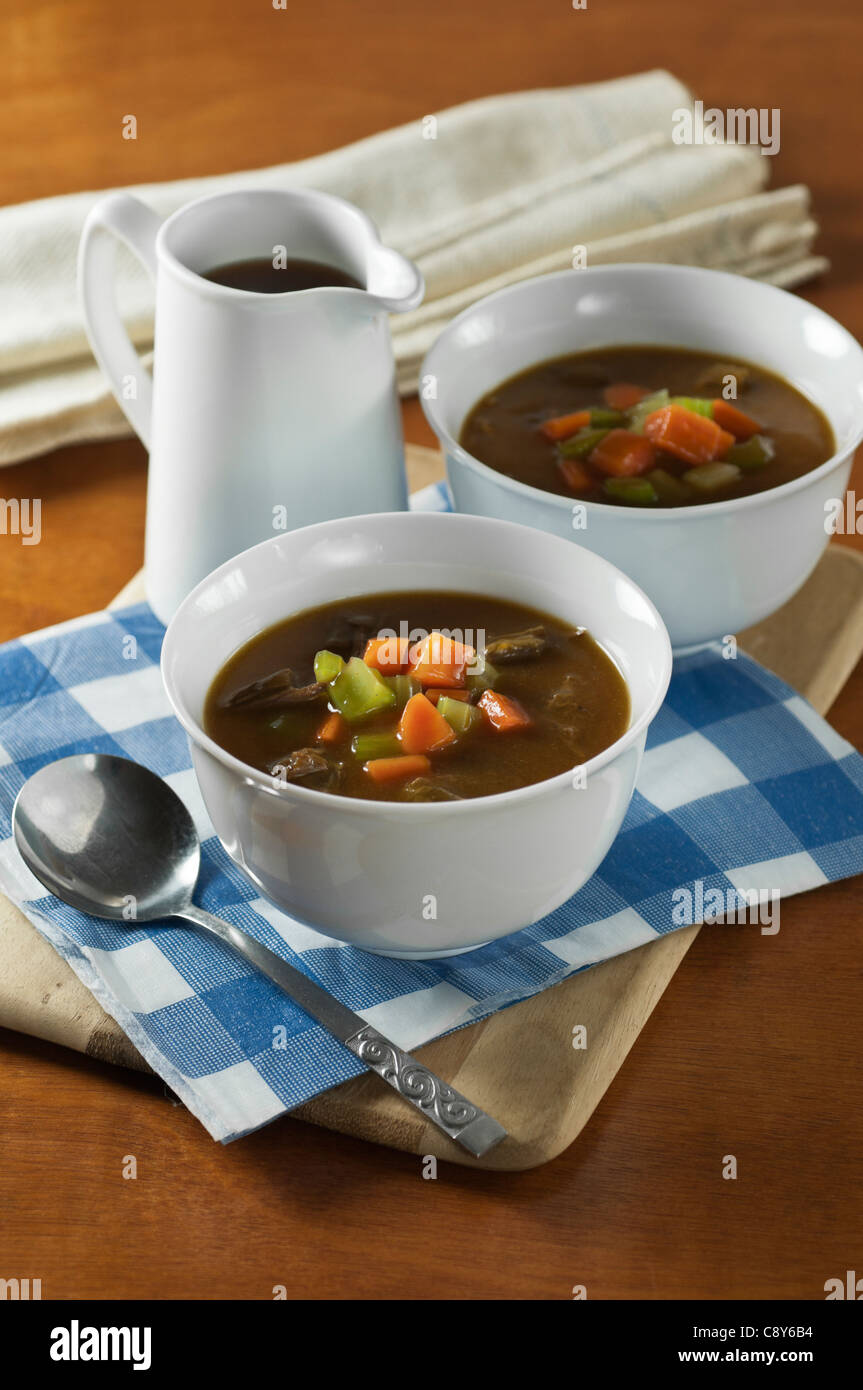 Oxtail soup in white bowls Stock Photo