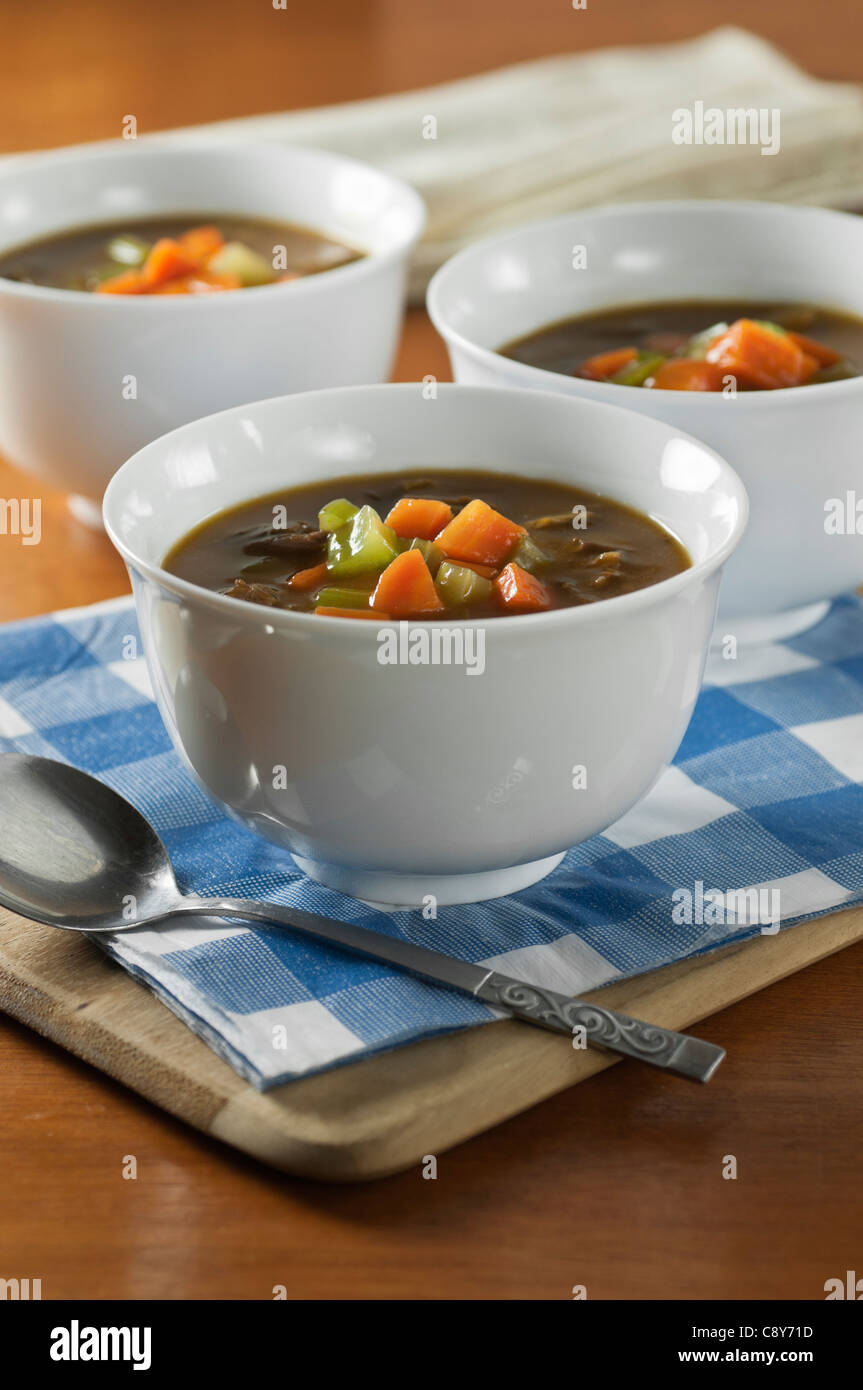 Oxtail soup in white bowls Stock Photo