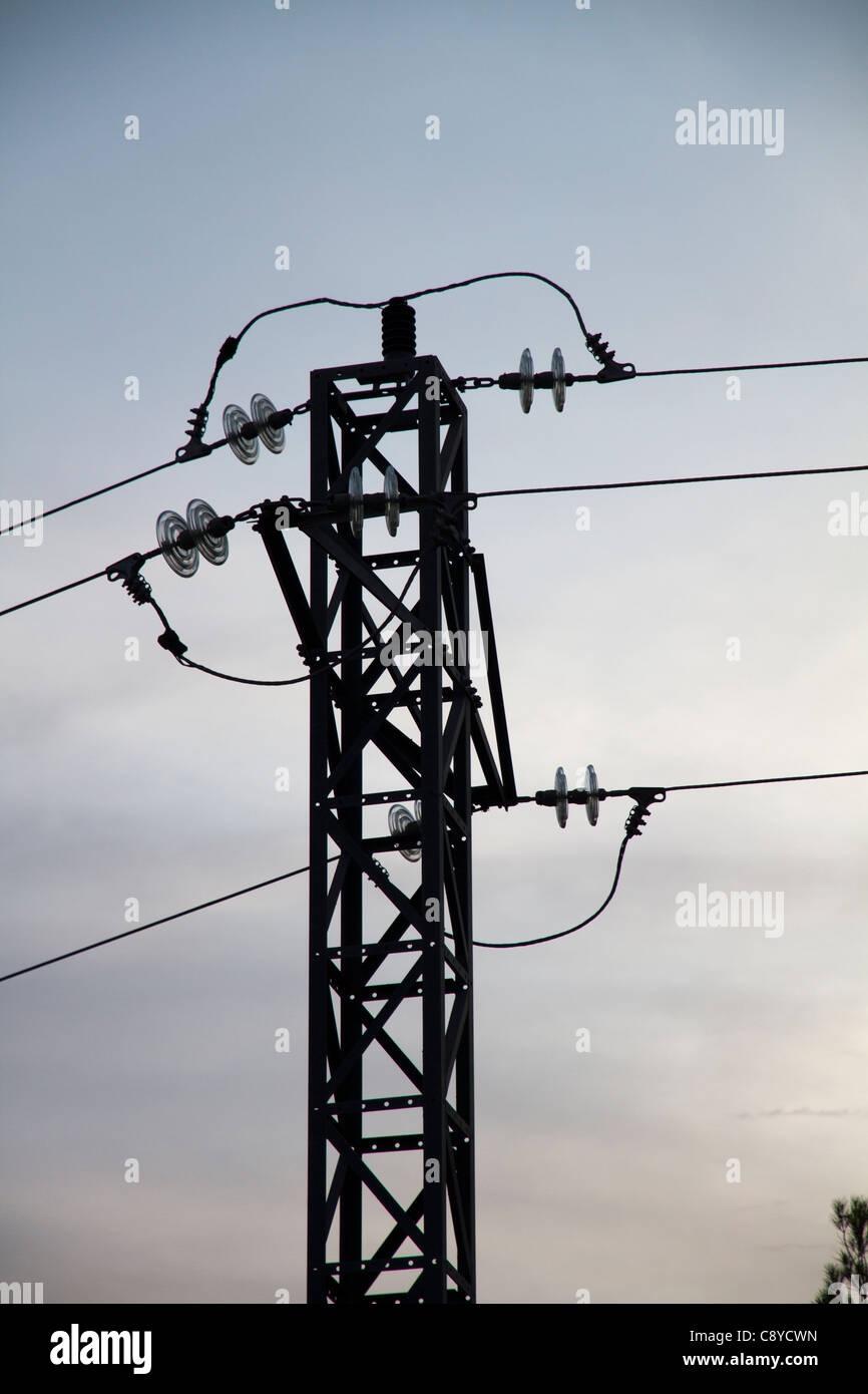Electrical pylon and power lines on cloudy sky Stock Photo - Alamy