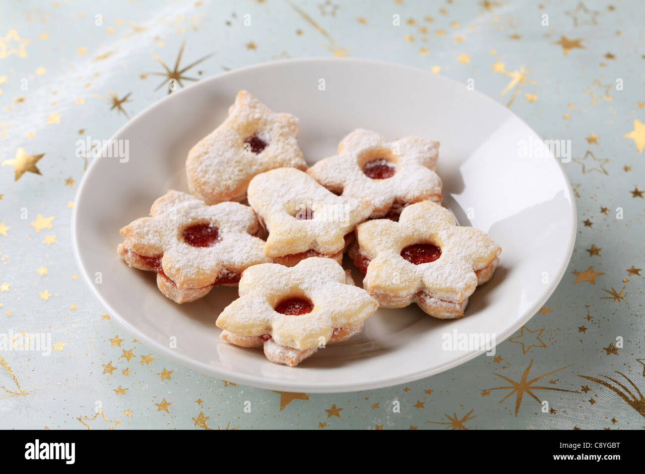 Jam filled cookies sprinkled with icing sugar Stock Photo Alamy