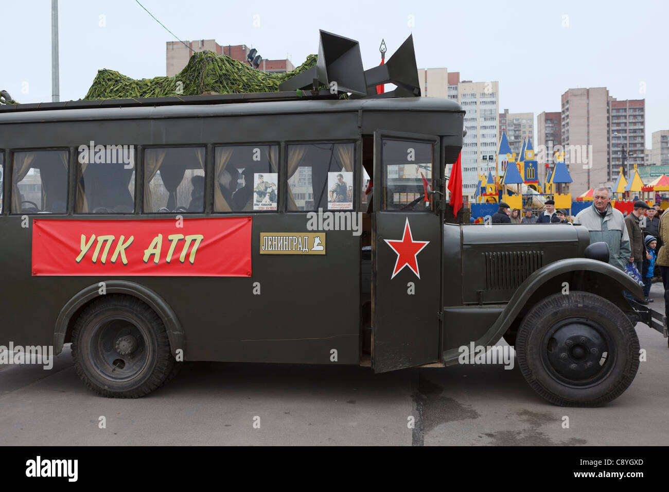 Soviet bus GAS-03-30 with red flags on November 4, 2011 in Saint-Petersburg, Russia. Stock Photo