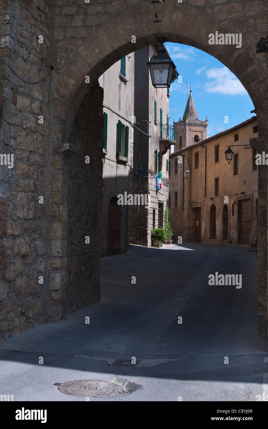 View from an archway down a narrow street in the medieval walled city ...