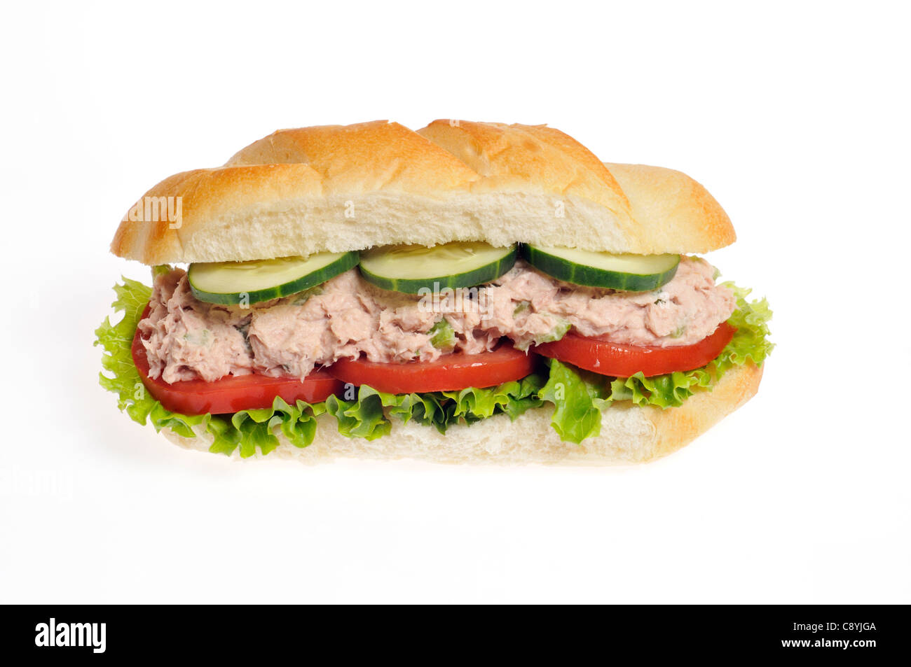 Tuna mayo salad sub sandwich with lettuce, tomato and cucumber on a white roll on white background, cutout. Stock Photo