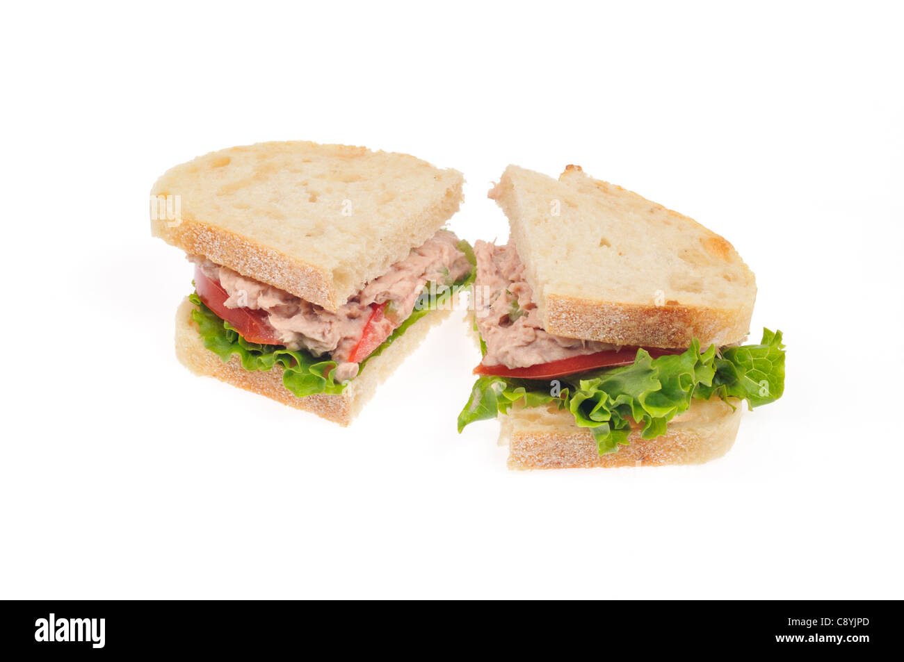 Tuna mayo sandwich on white bread with lettuce and tomato cut in half on white background, cutout. Stock Photo
