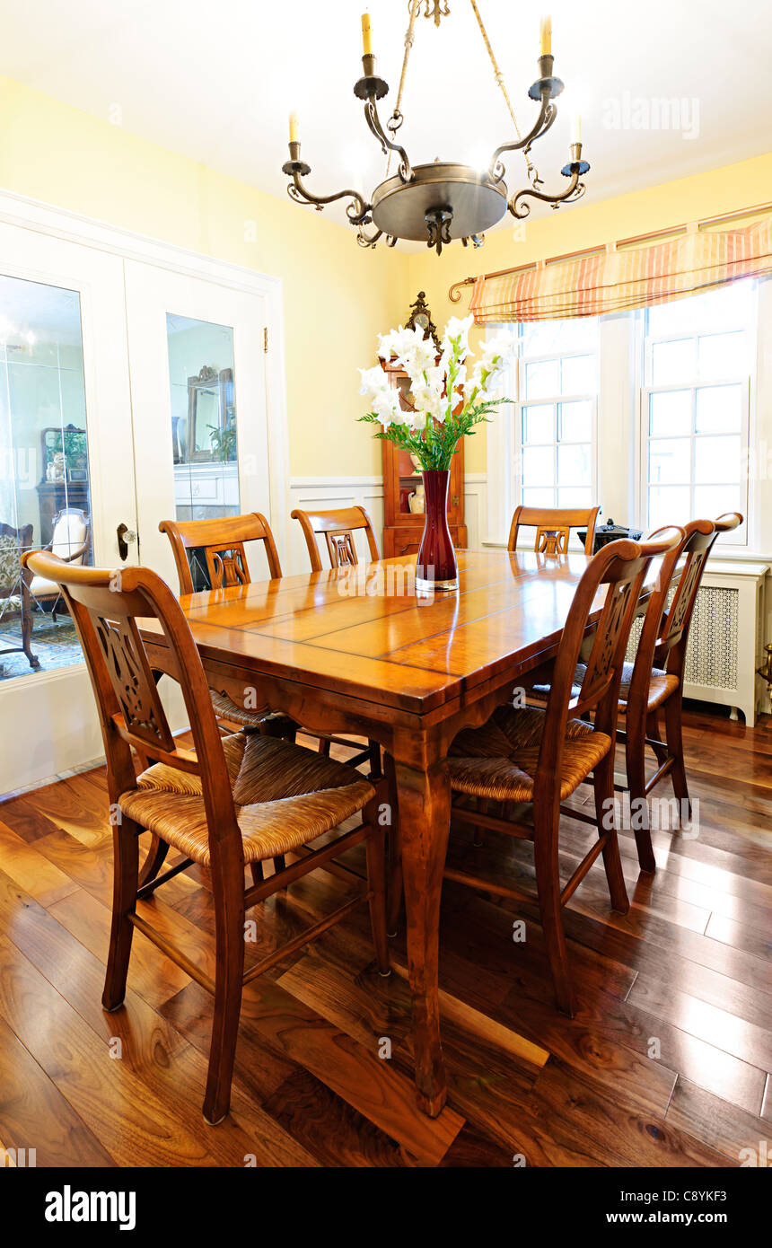 Dining room interior with antique wooden table and chairs in house ...