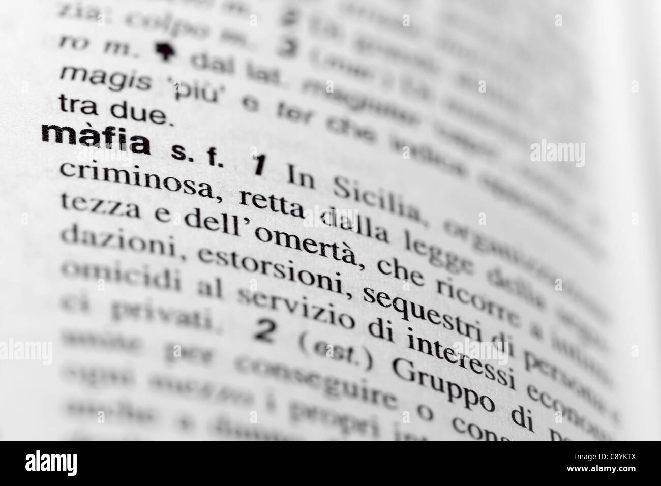 Focusing on word MAFIA  in italian dictionary. Stock Photo