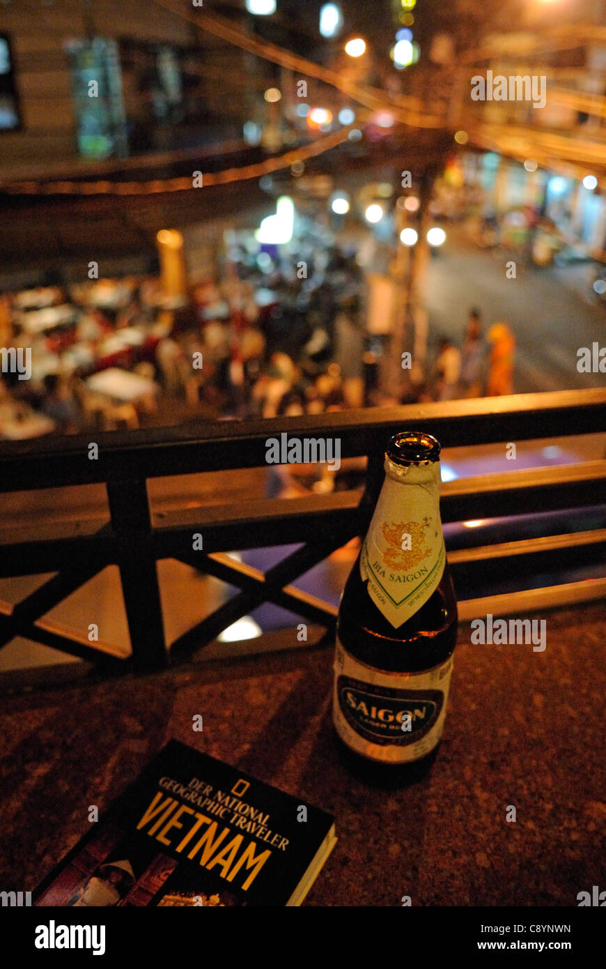 Asia, Vietnam, Ho Chi Minh City (Saigon). Drinking a bottle of Saigon beer "Bia Saigon" in the backpackers area around Pham N... Stock Photo
