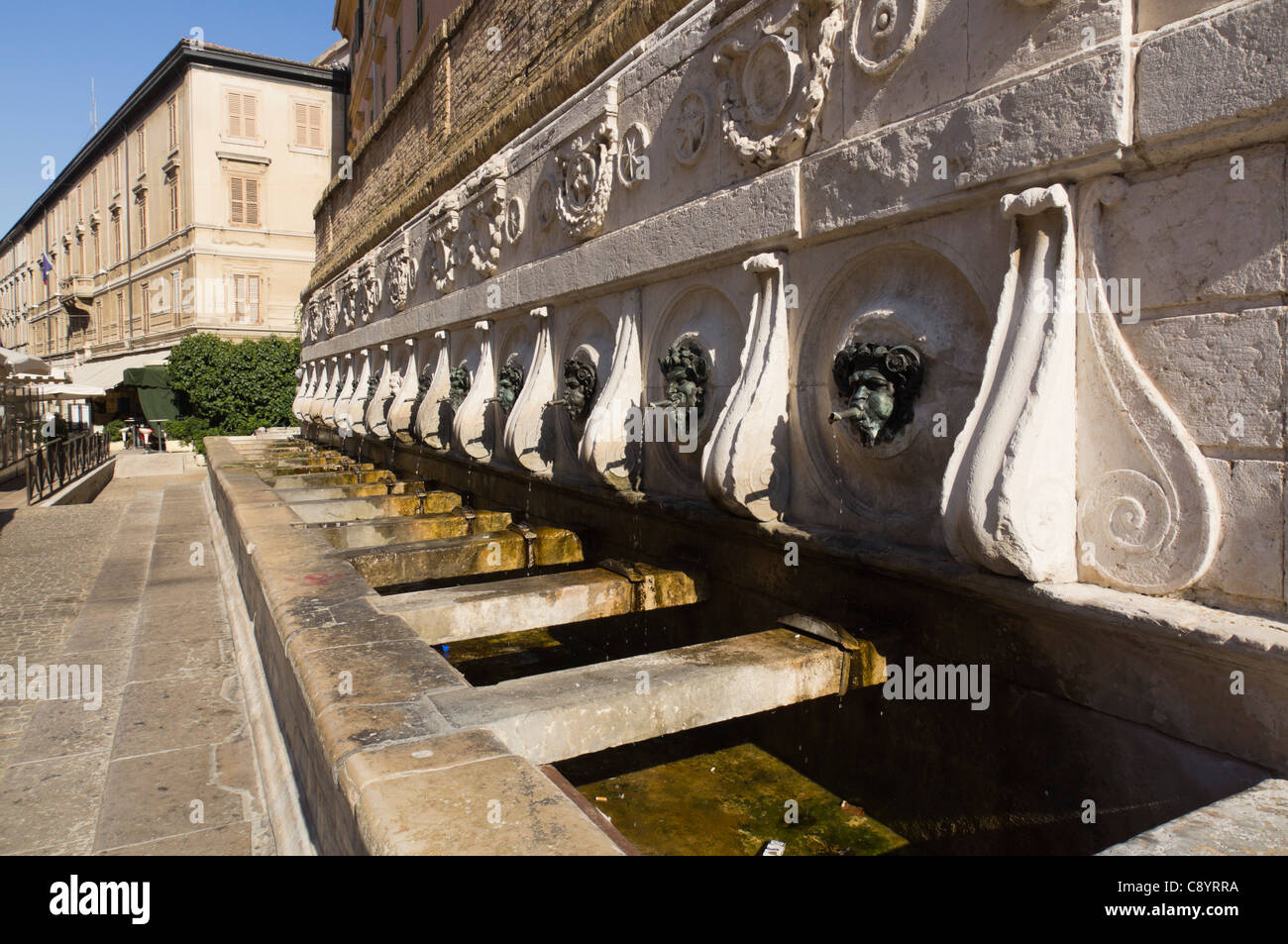 Ancona Italy - Fontana del Calamo, XIV century, attr Pellegrino Tibaldi. For horse watering. Bronze satyr head spouts. Stock Photo