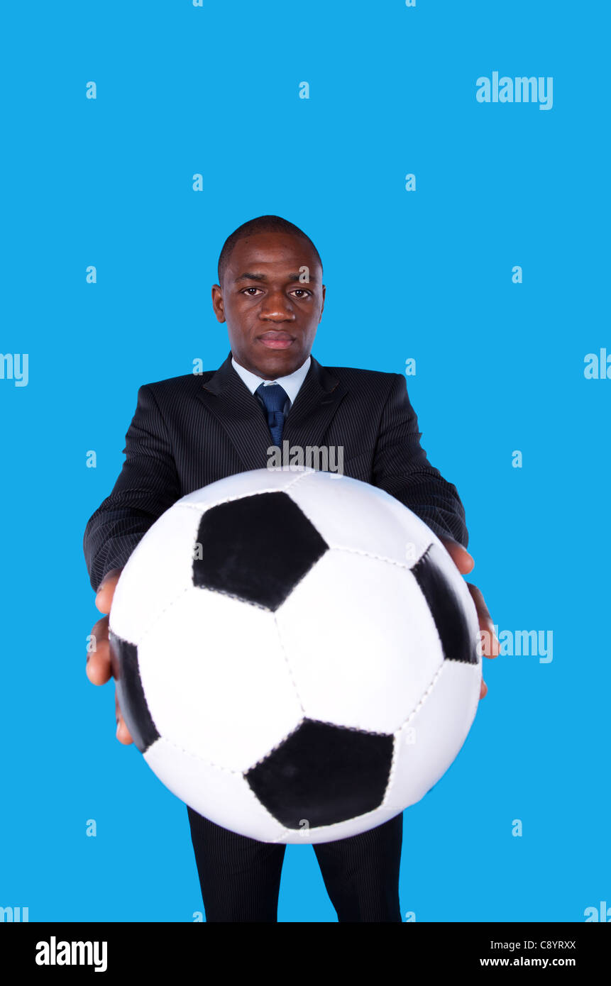 African businessman holding a soccer ball Stock Photo - Alamy
