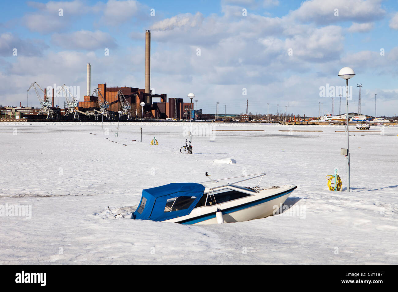 Boat In Frozen Harbor Stock Photo