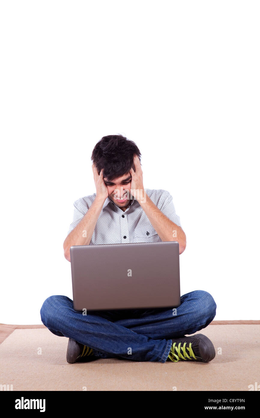 Stressed young men working with his laptop on the floor Stock Photo Alamy