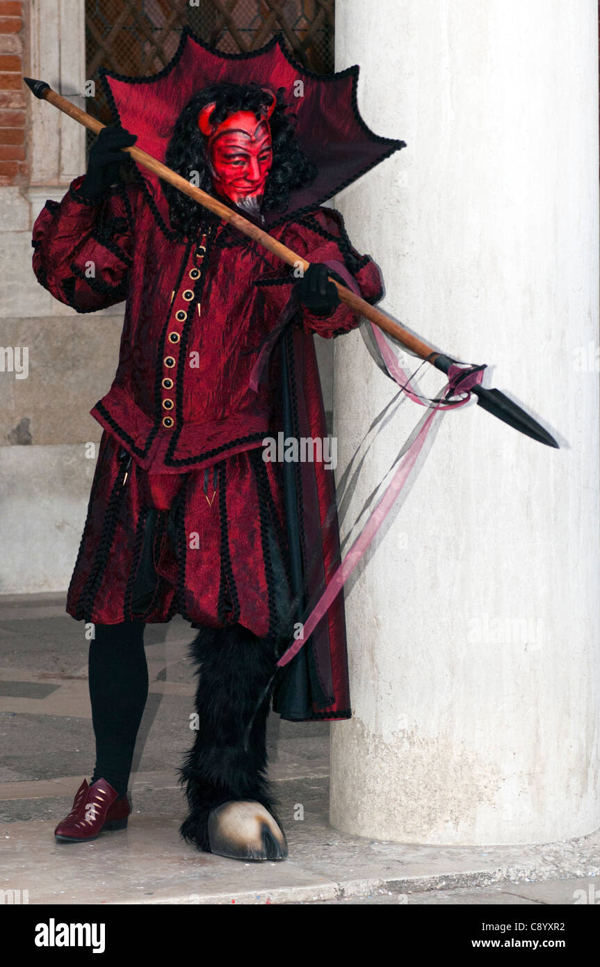 artist in devil costume posing for public during Venice carnival Stock Photo