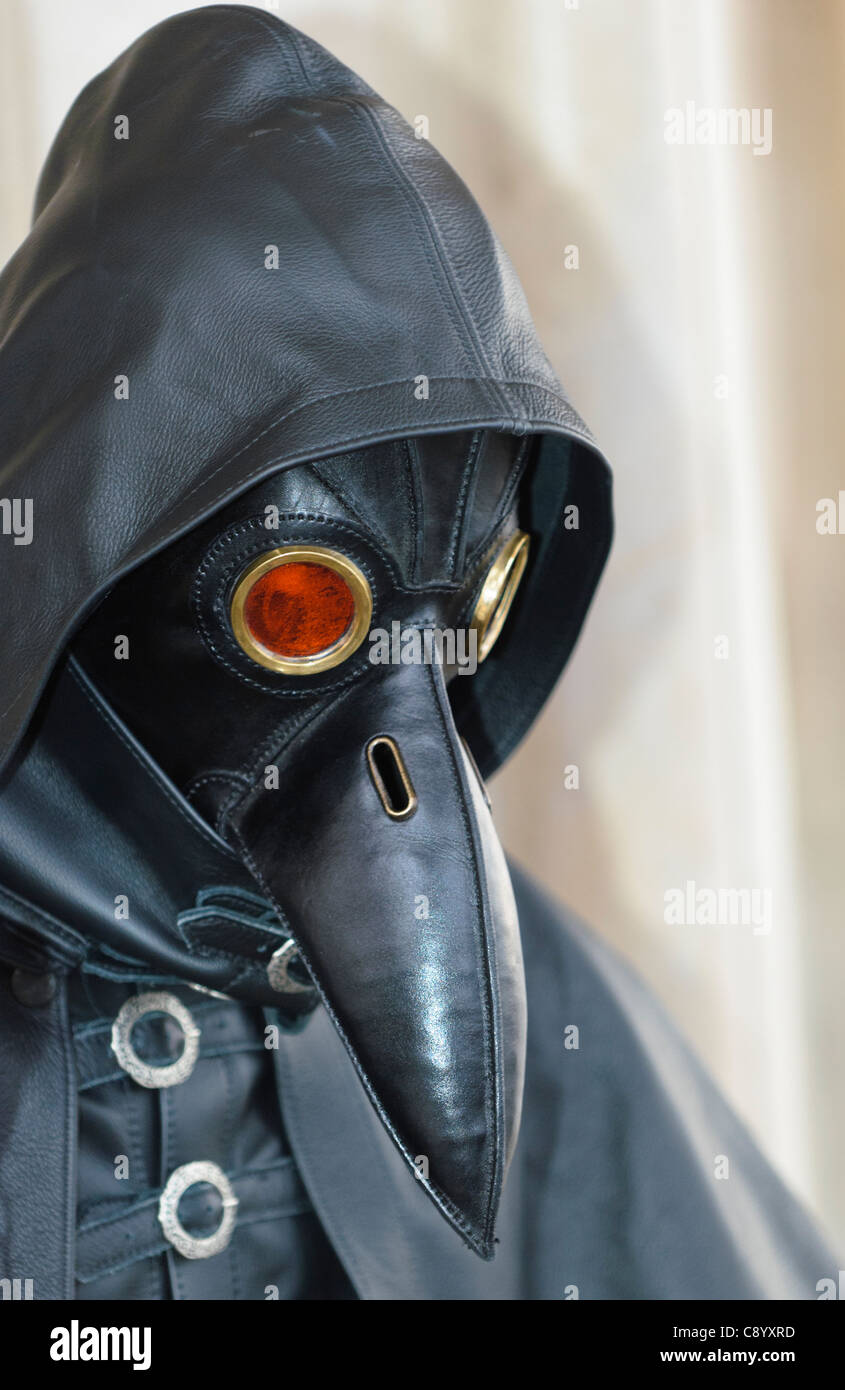 plague doctor in bird-like mask Stock Photo