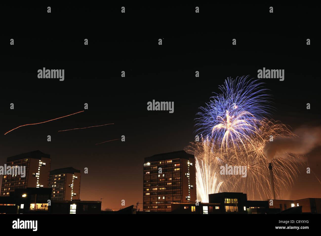 Fireworks explode over Glasgow Green, Glasgow, UK,with Gorbals flats