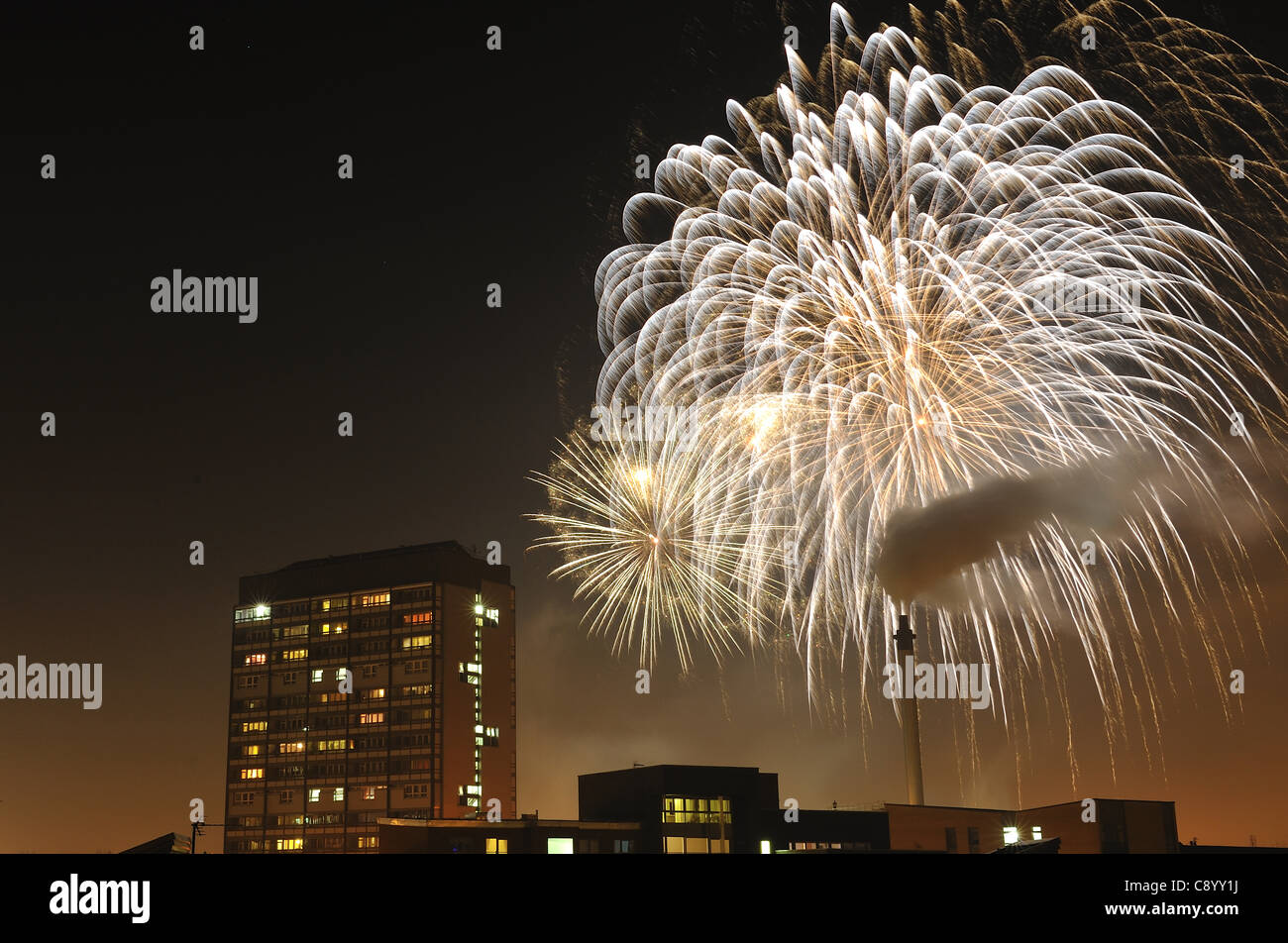 Fireworks explode over Glasgow Green, Glasgow, UK,with Gorbals flats