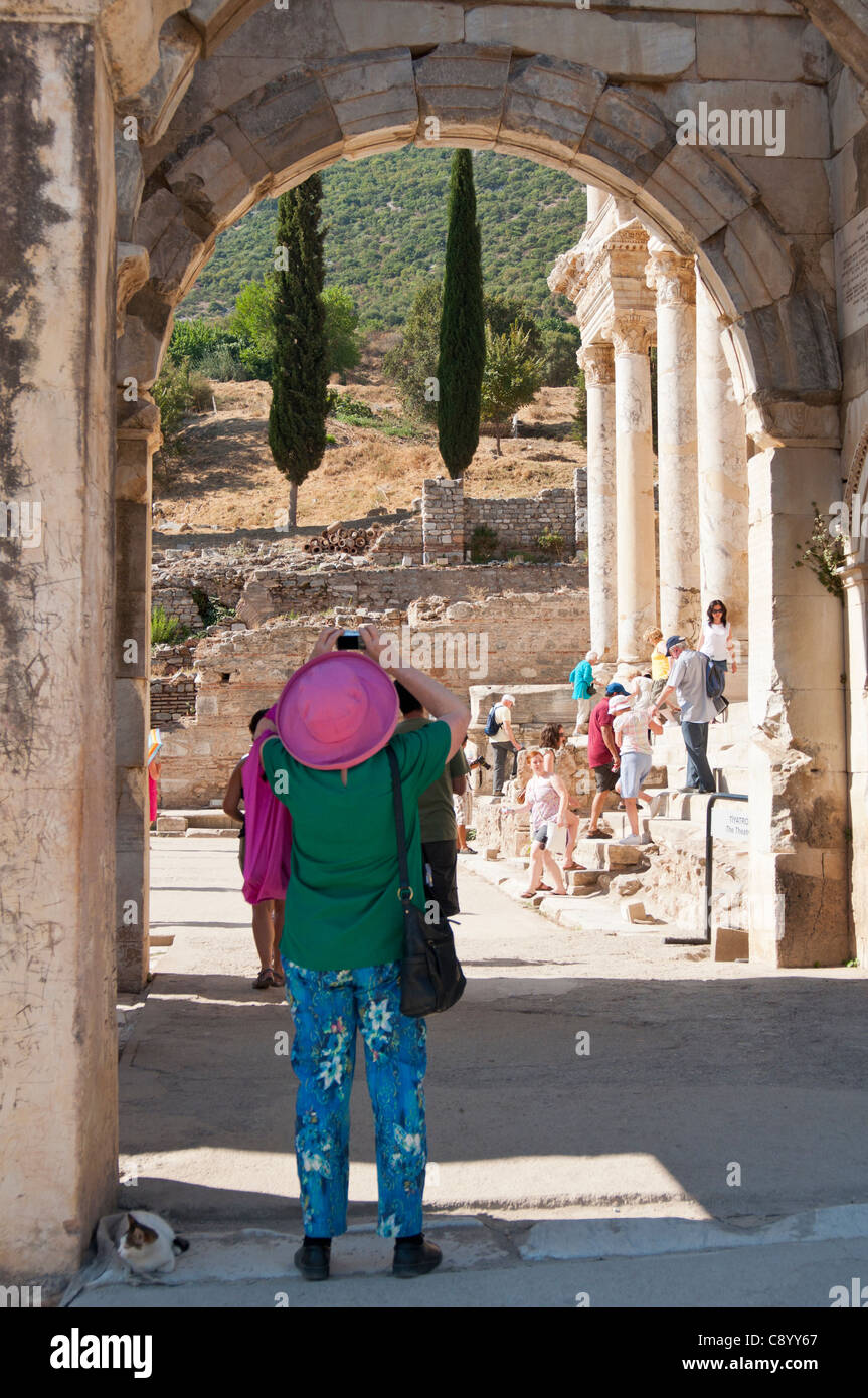 Tourist takes photo of the library Celsus bibliotheque in the ancient town of Ephesus in Turkey. Stock Photo