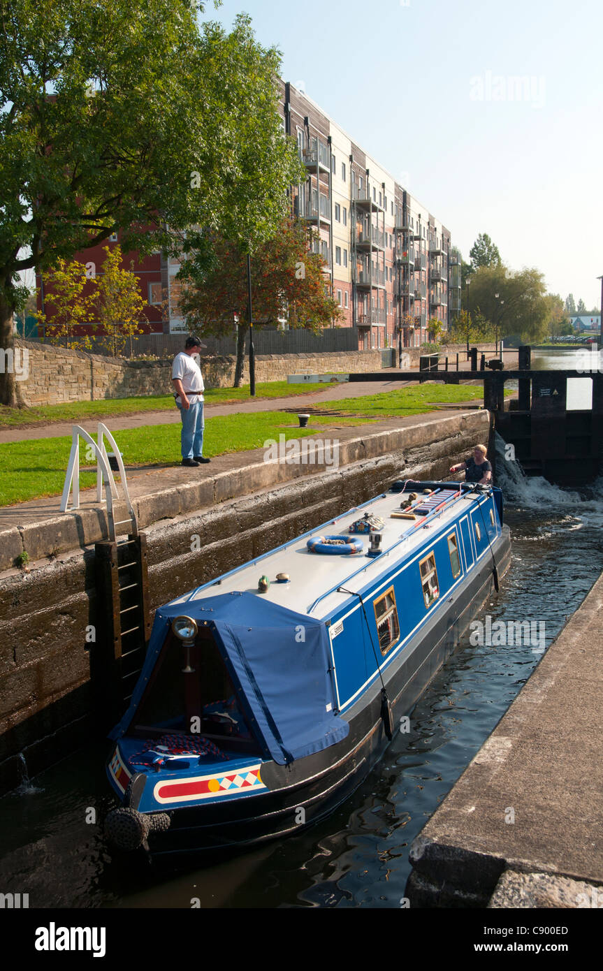 A narrowboat in a lock on the Leeds and Liverpool Canal at  Wigan, Greater Manchester, England, UK Stock Photo