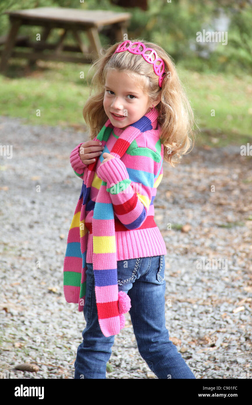 girl with fall outfit and smiling at camera portrait Stock Photo