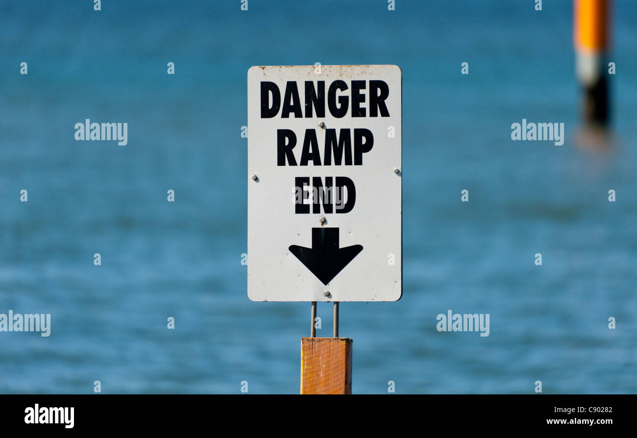 A sign warning about the end of the boat ramp Stock Photo - Alamy