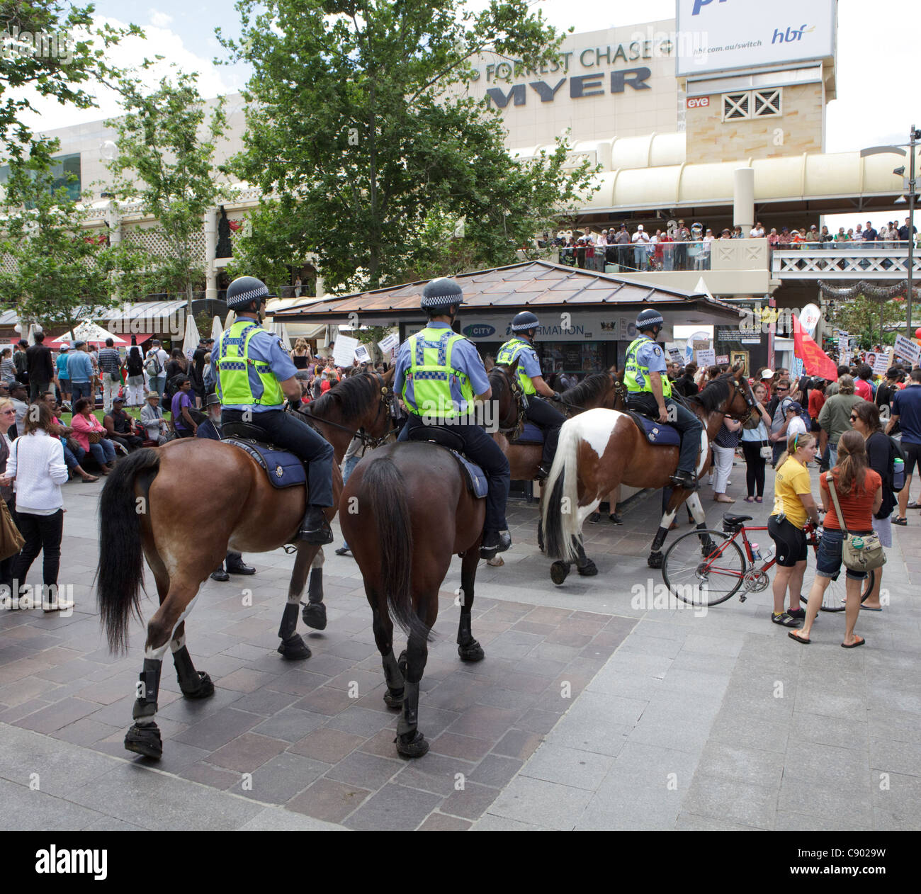 Mounted police watch over protesters at a demonstration held to coincide with the start of CHOGM 2011. Stock Photo