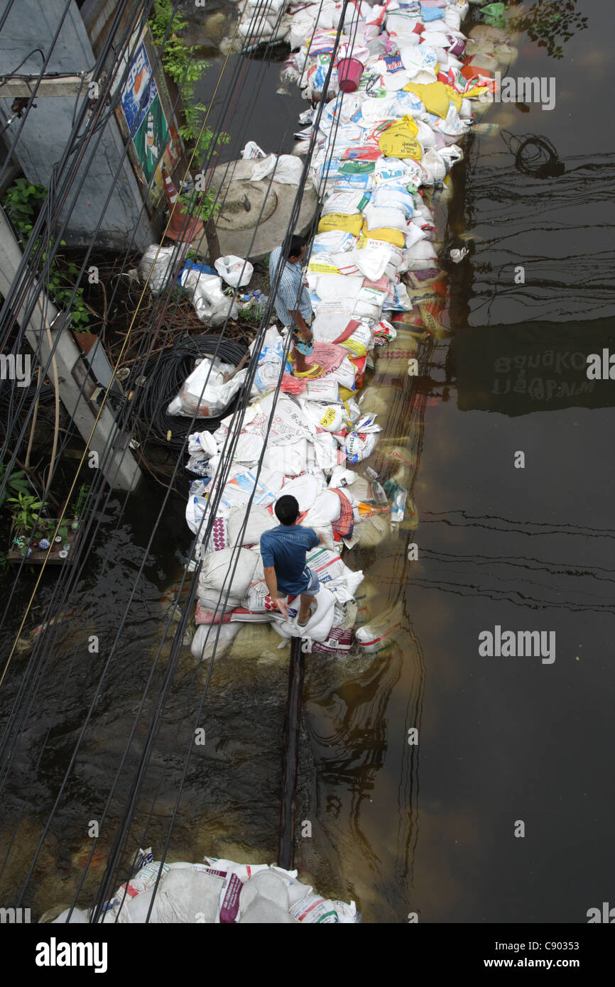 People walking on sandbags wall Rangsit Pathum Thanni Province Thailand Stock Photo Alamy