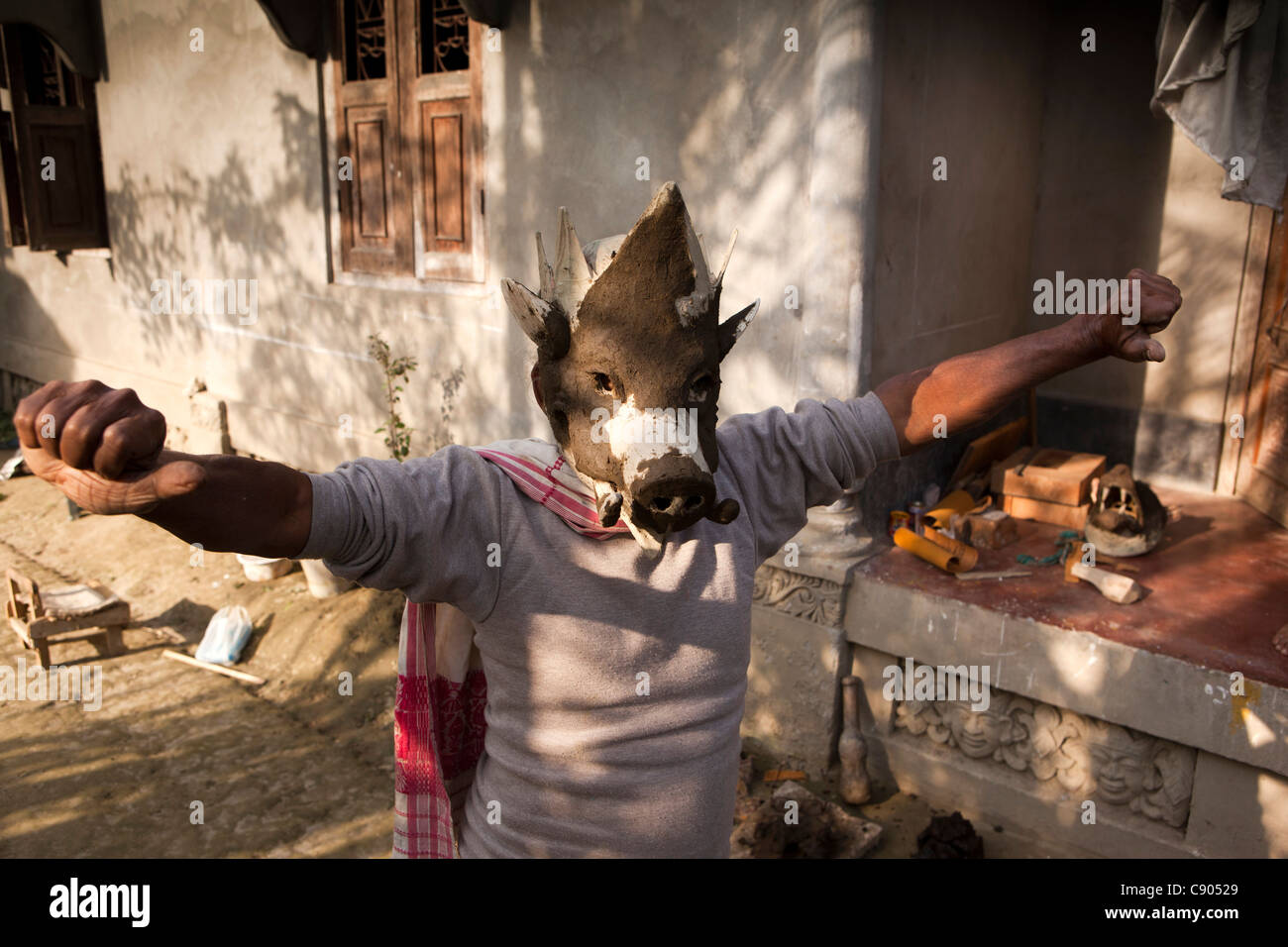 India, Assam, Majuli Island, crafts, mask making workshop man showing animal masks for Ankiya Bhaona dance and theatre Stock Photo