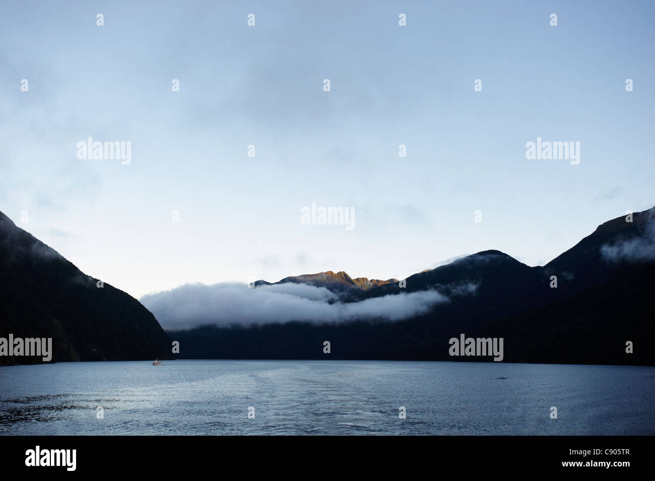 Low cloud at dawn, Doubtful Sound, Fiordland National Park, South Island, New Zealand Stock Photo