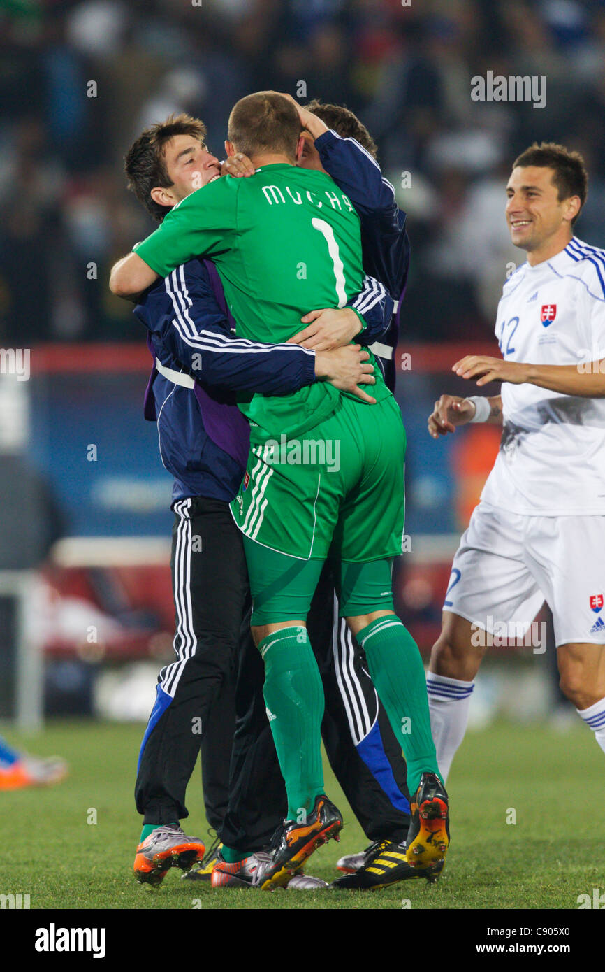 Slovakia goalkeeper Jan Mucha (1) embraces teammates after Slovakia defeated Italy in a 2010 FIFA World Cup Group F match. Stock Photo
