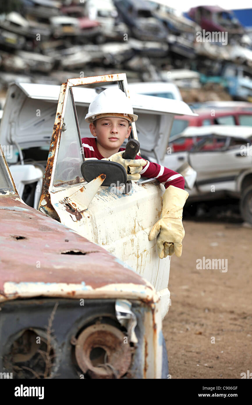 boy at the dump cars Stock Photo