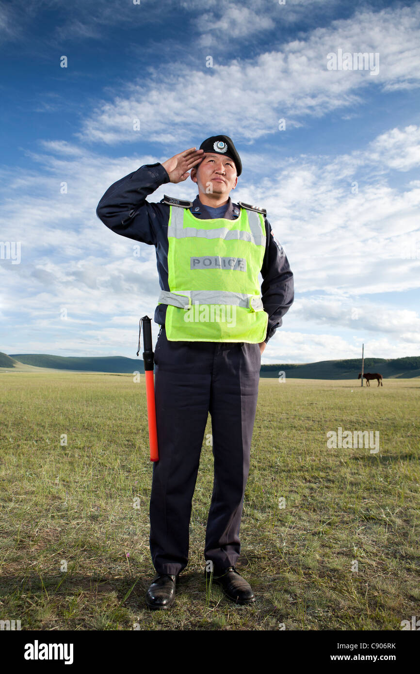 Mongolian police man salute , Tsagaannuur, Khövsgöl, Mongolia Stock Photo