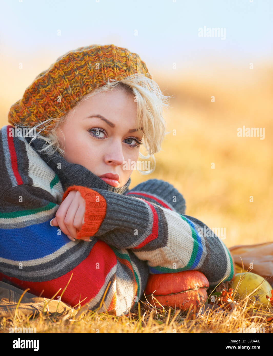 Portrait of a sad young woman outdoor in autumn. Stock Photo