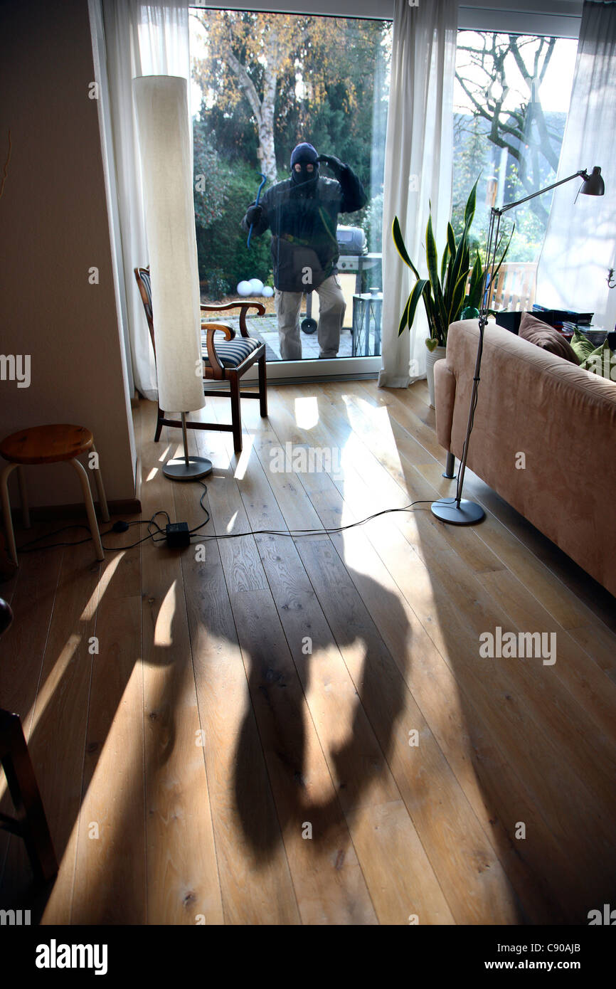 Burglar in a private house. Daylight burglary. Breaking into a house