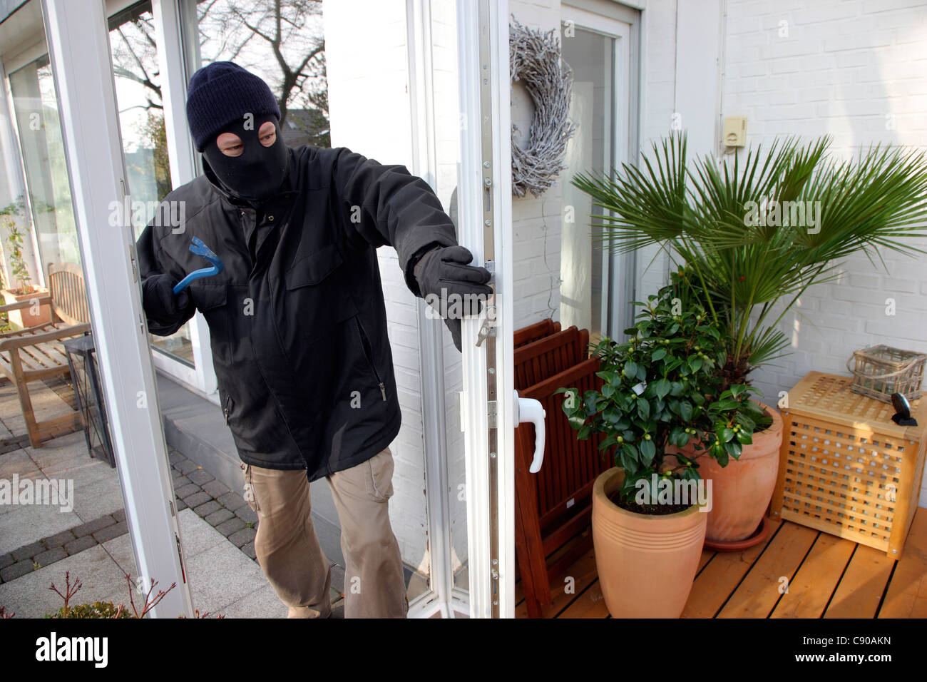 Burglar in a private house. Daylight burglary. Breaking into a house
