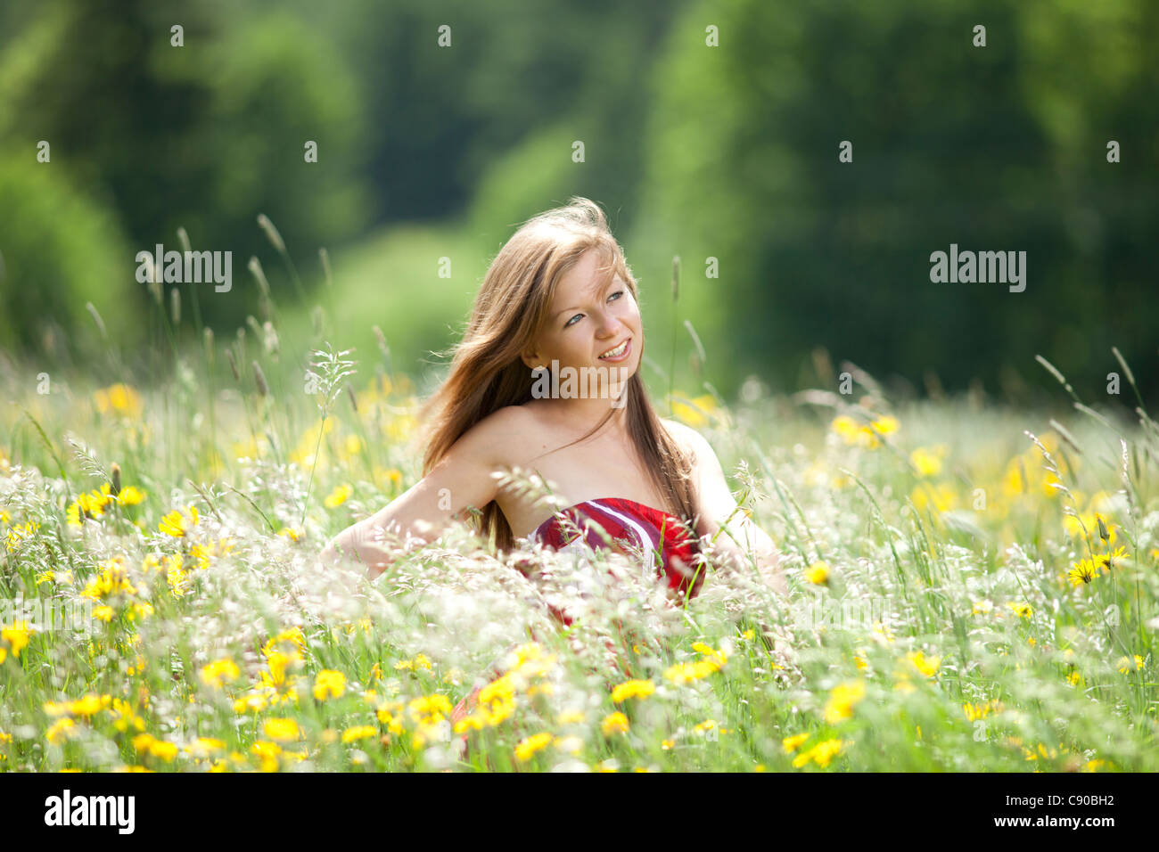 Optimistic glance of a young woman Stock Photo