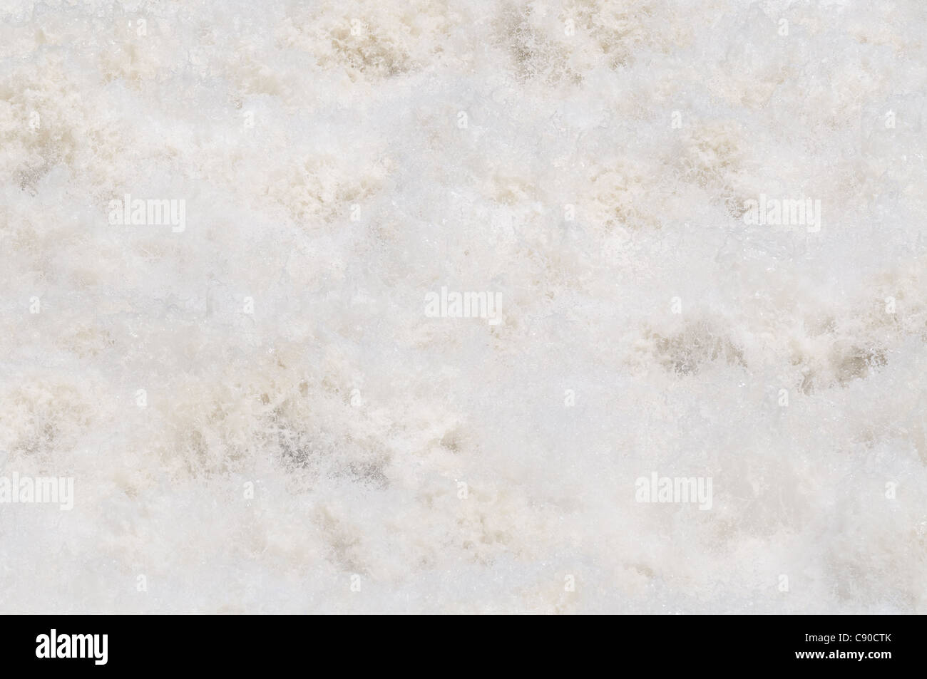 Foam and spray at an artificial waterfall that drains out flood water in Thailand. Stock Photo
