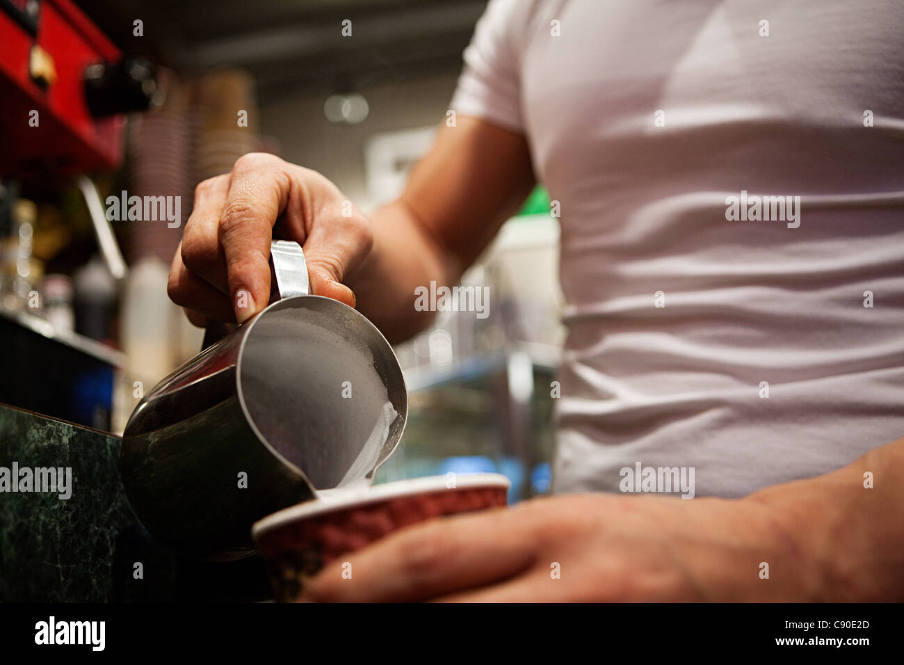 Man making coffee in cafe, close up Stock Photo