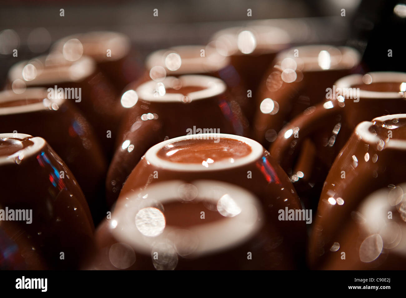 Upside down coffee cups, close up Stock Photo - Alamy