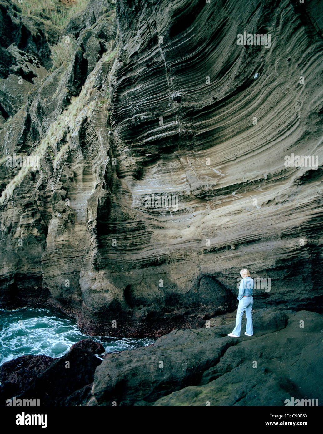 Pumice rock molded by erosion, cliff line at Porto de Pesca, Capelas, northern shore of Sao Miguel island, Azores, Portugal Stock Photo