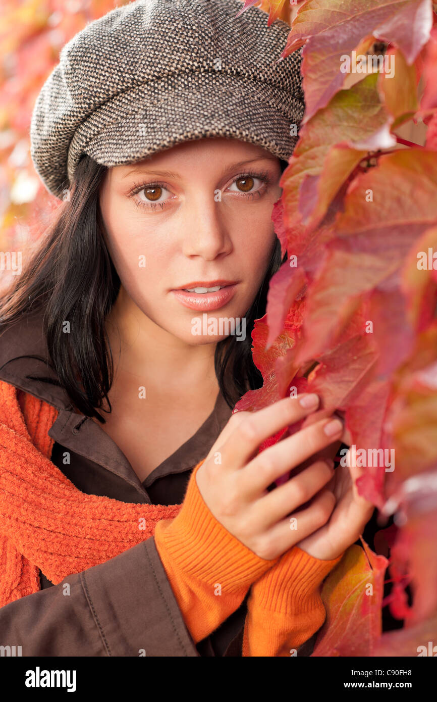 Autumn leaves portrait of beautiful female model posing fashion outfit Stock Photo