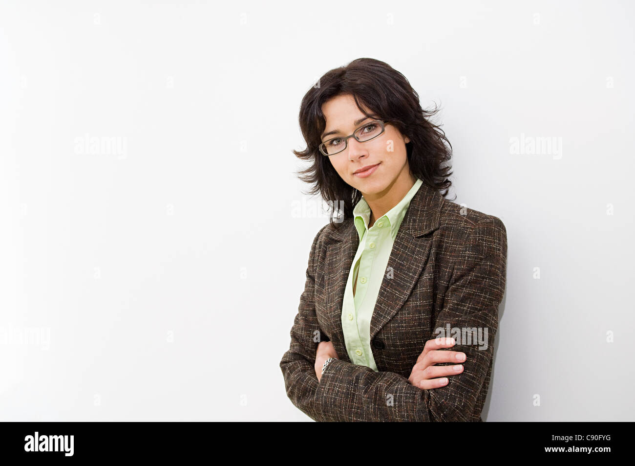 Businesswoman with arms crossed, portrait Stock Photo