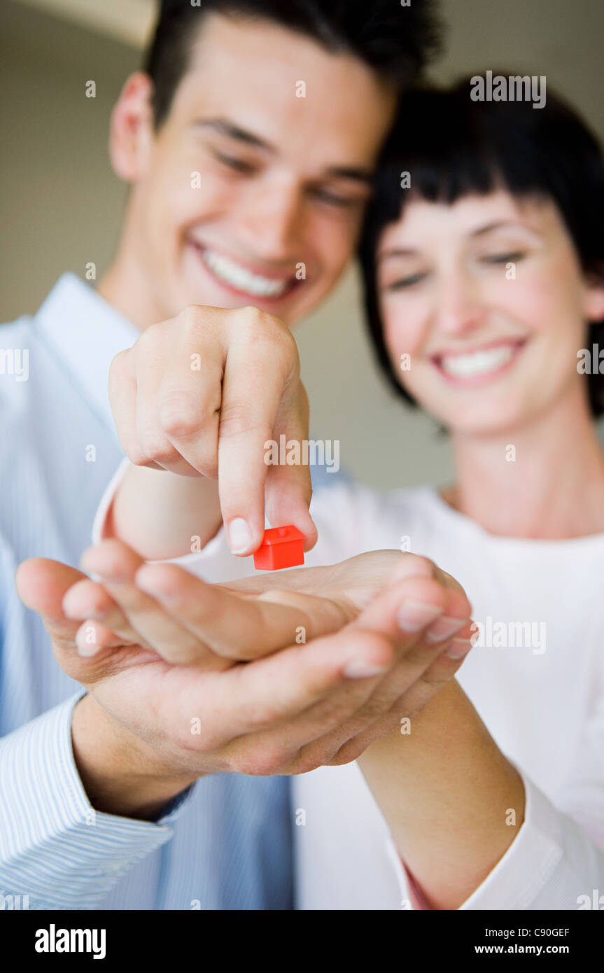 Couple holding model house Stock Photo