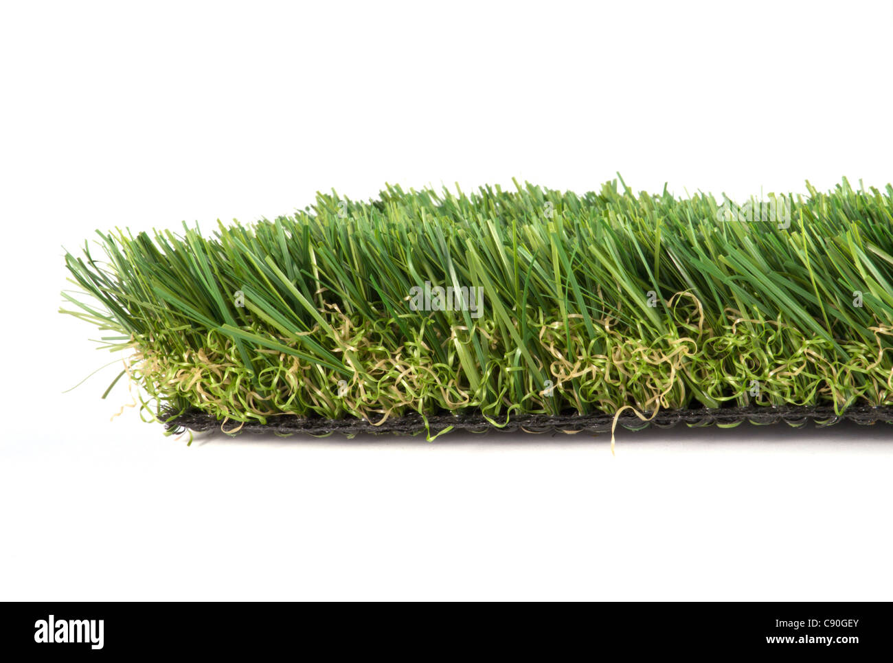 patch of green artificial grass on a white background Stock Photo