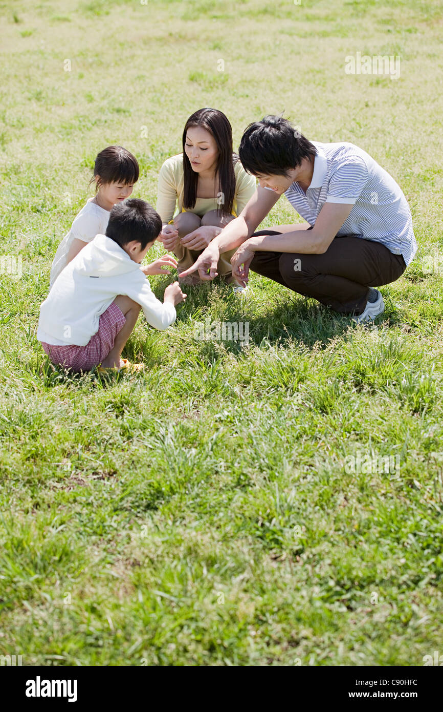 Family with two children in field Stock Photo