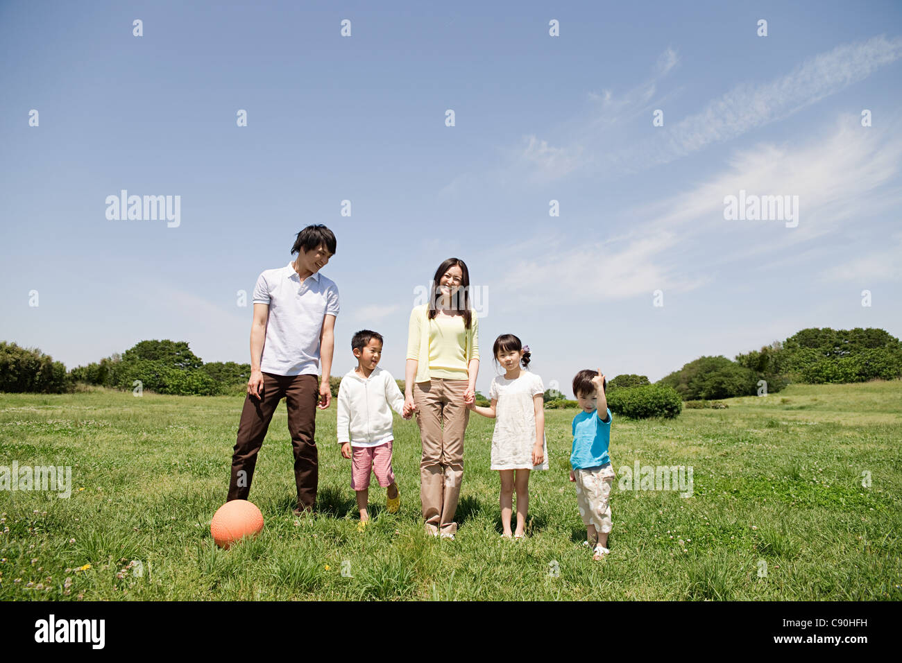 Family with three children in field Stock Photo
