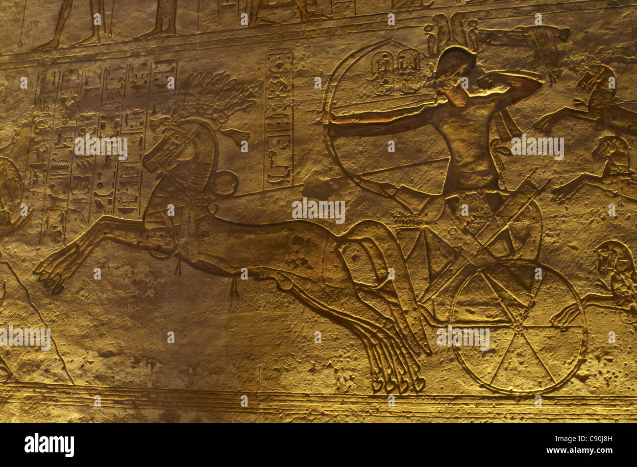 Egyptian art. Great Temple of Ramses II. Ramses II in a chariot with a bow and arrow at the Battle of Kadesh. Abu Simbel. Egypt. Stock Photo