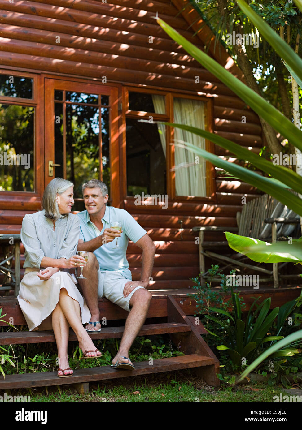 Older couple sitting on porch hi-res stock photography and images - Alamy
