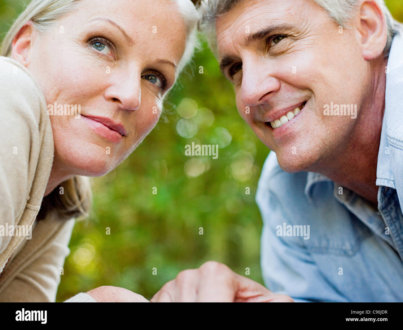 Close up portrait of couple looking away Stock Photo