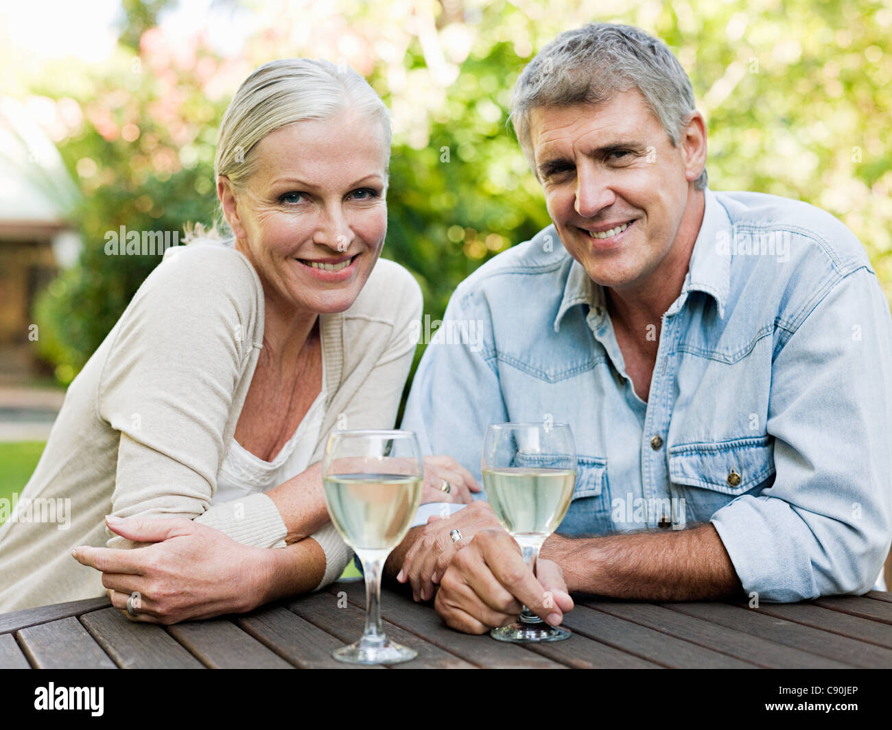 Couple with white wine, portrait Stock Photo