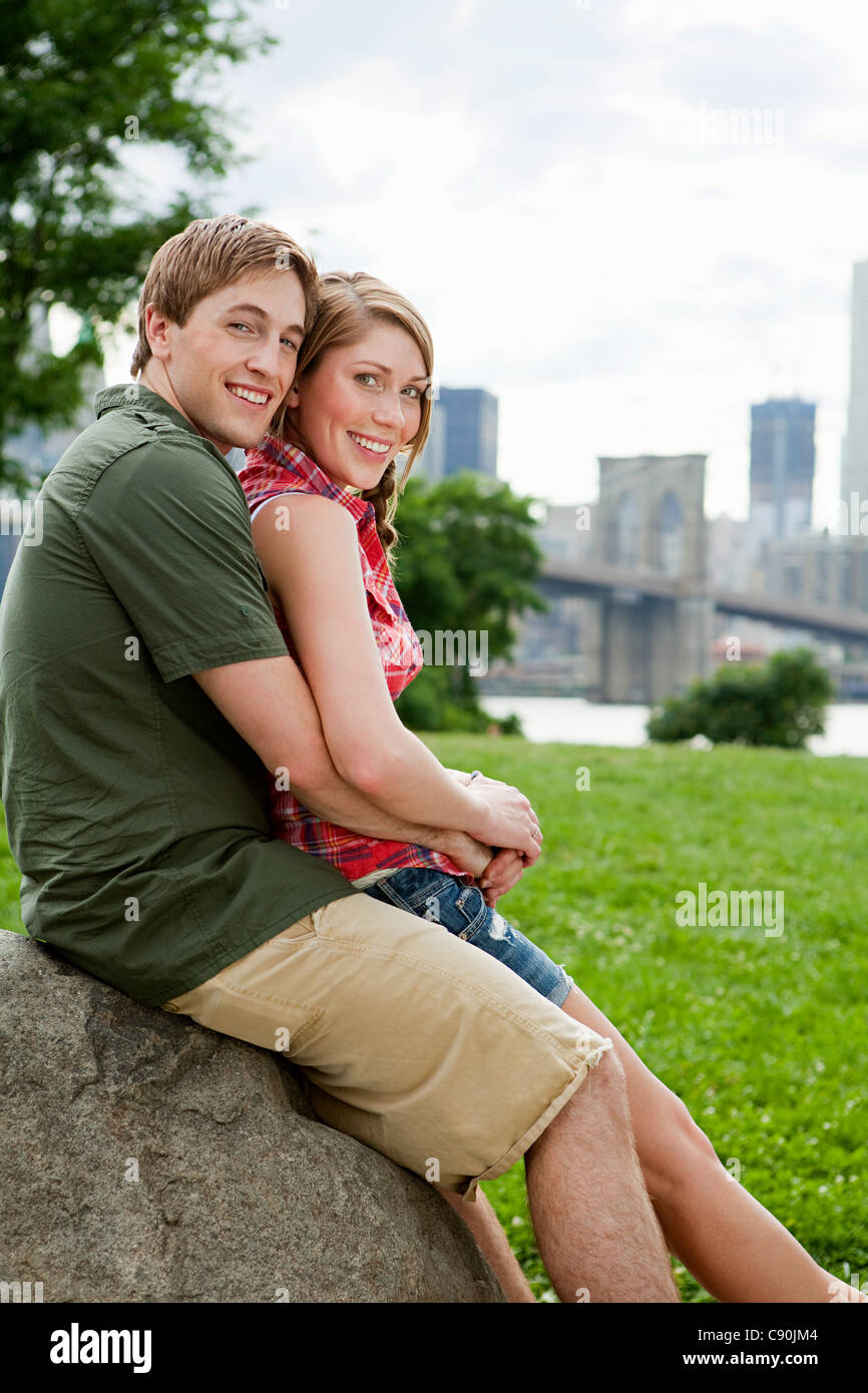 Portrait of young couple in city park Stock Photo